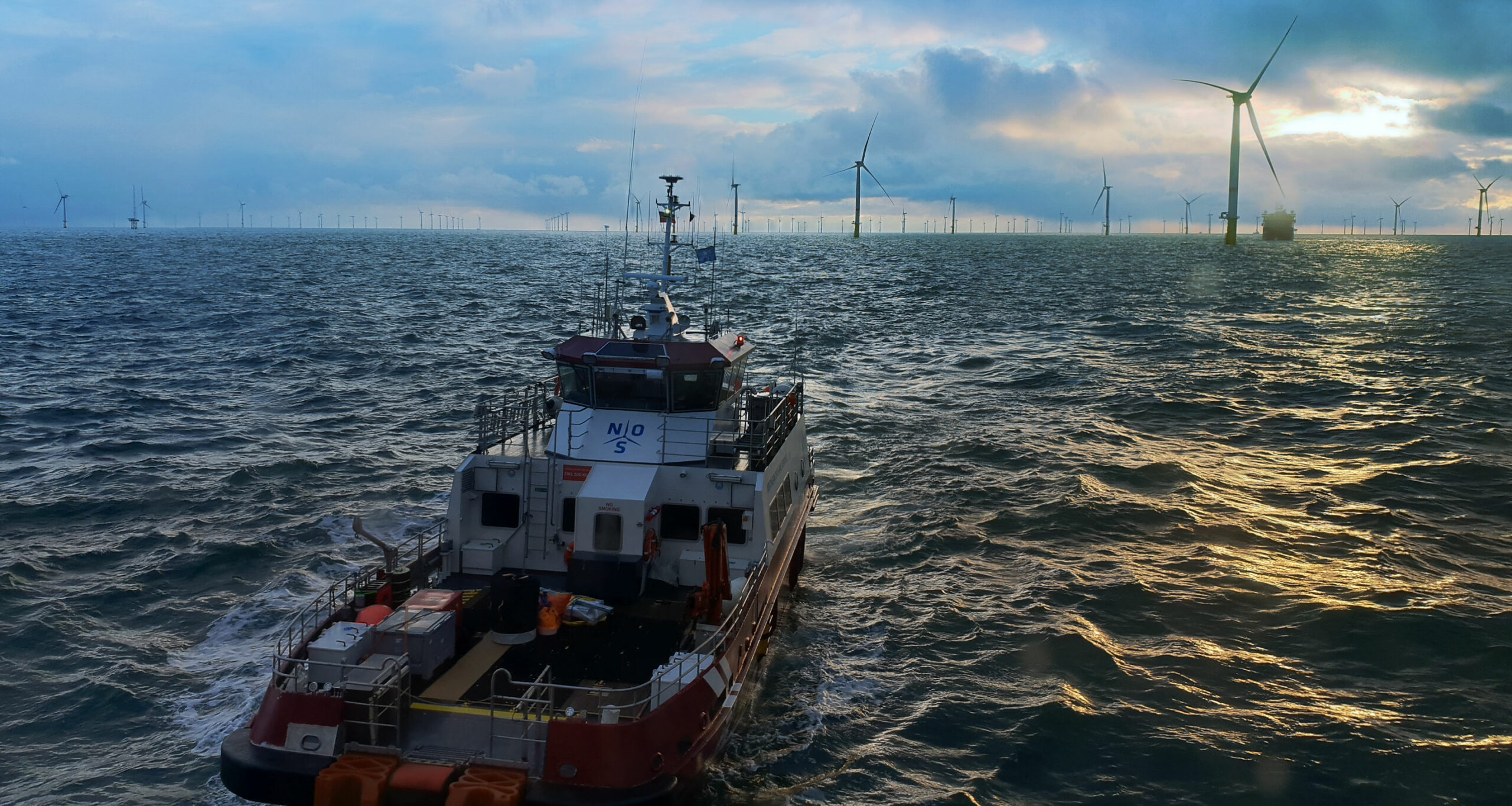 CTV Vessel heading towards a Wind Farm in rought seas.